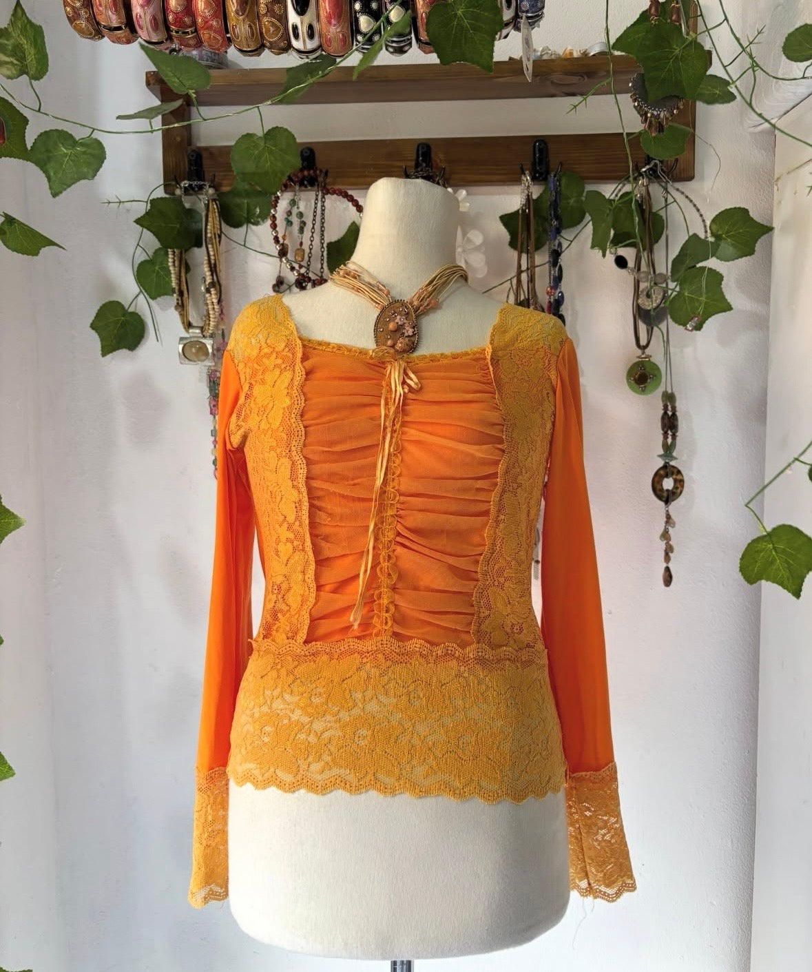 Orange princess lace top with cinched bust mesh material
