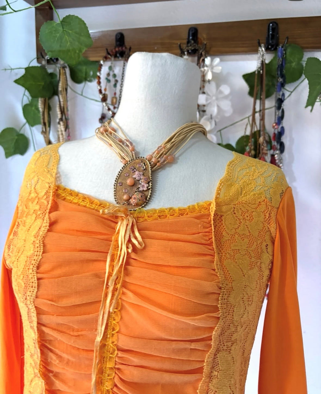 Orange princess lace top with cinched bust mesh material