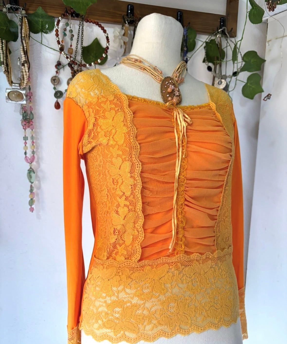 Orange princess lace top with cinched bust mesh material